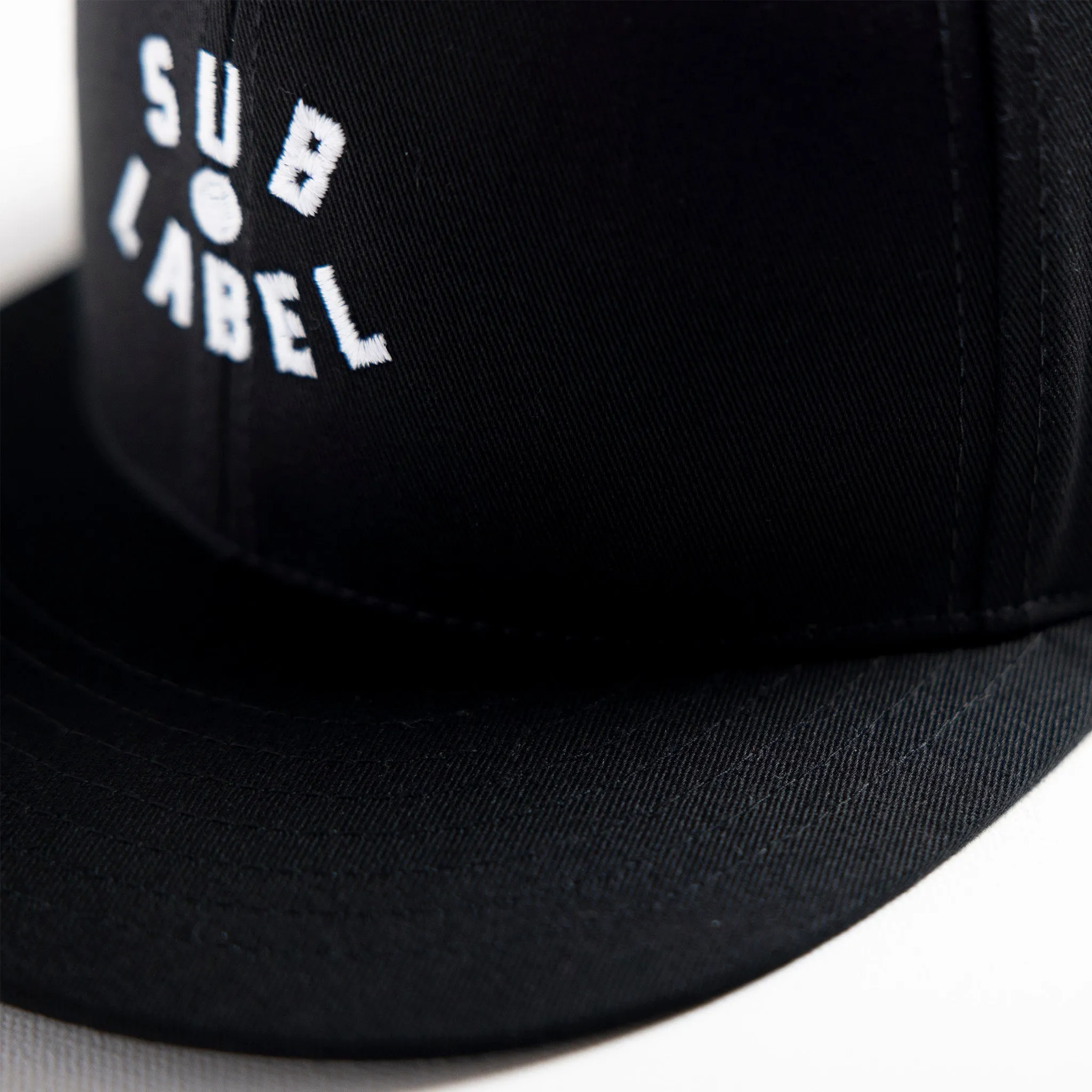 pupil (white) • flatbill snapback hat